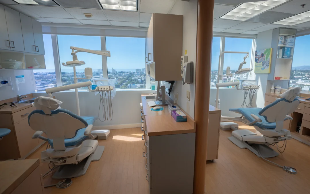 Bright dental operatory with two treatment chairs and large windows at Best Natural Smile.